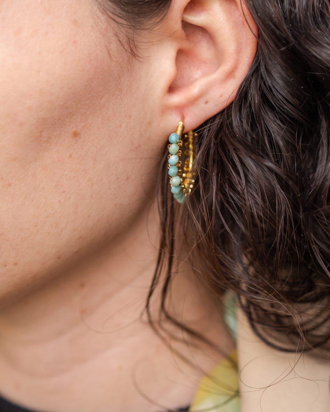 Sterling silver blue-green drop earrings with layered details shown worn on the ear